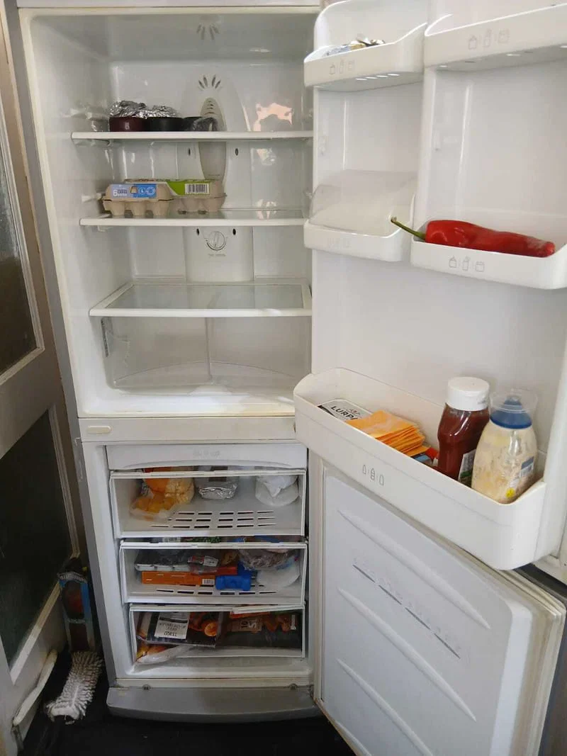Clean refrigerator with organised shelves