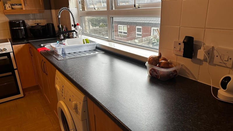 Clear kitchen worktop after cleaning and decluttering